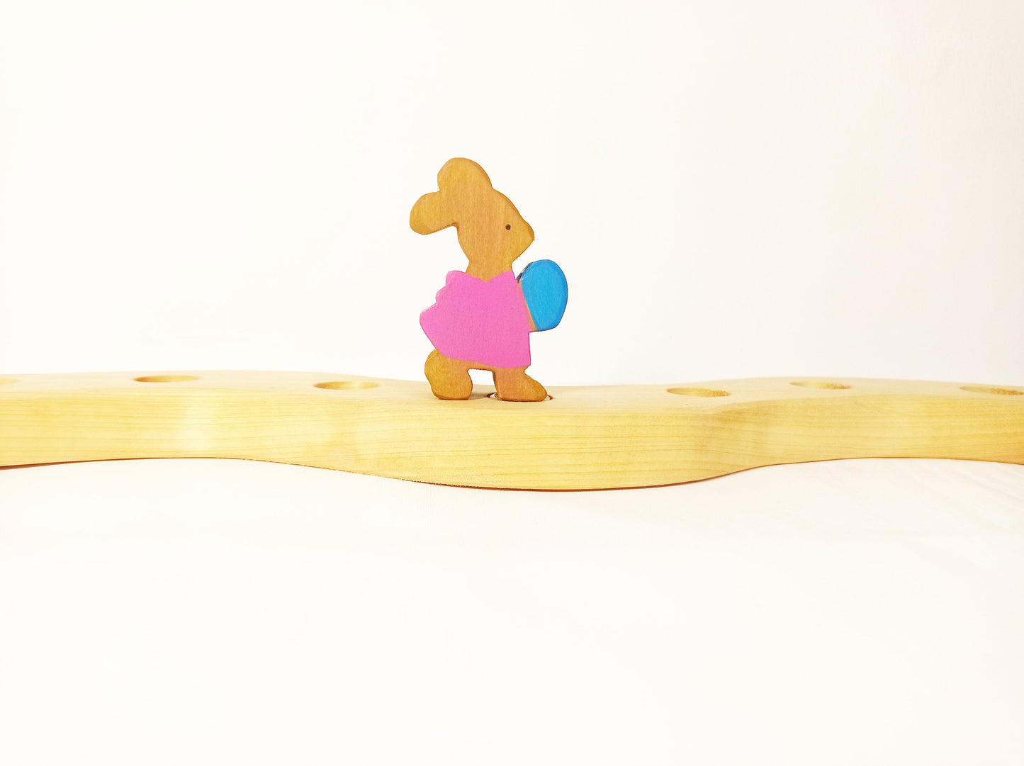 Bunny holding egg celebration ring ornament