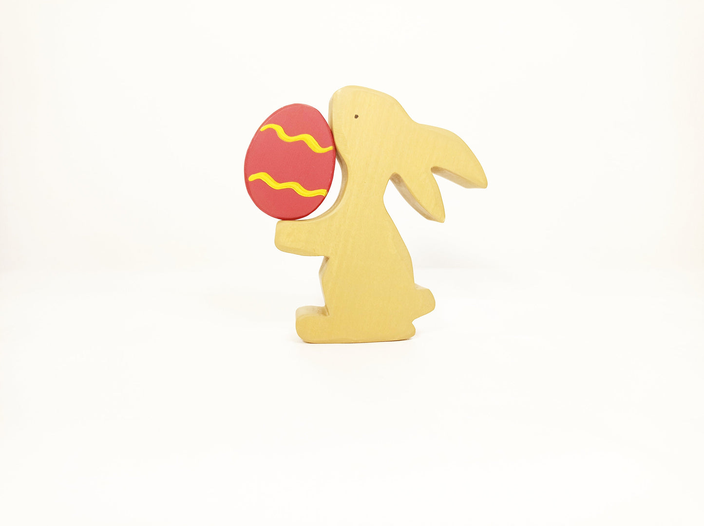 Bunny with red Easter egg wooden toy decoration