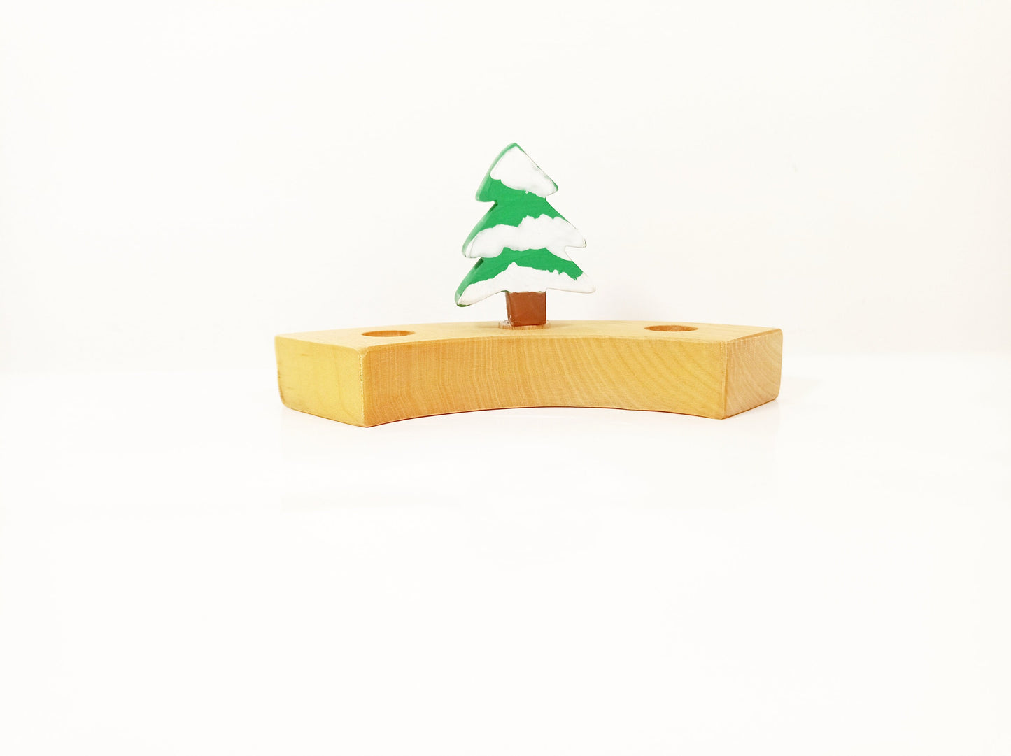 Evergreen tree with snow celebration ring ornament